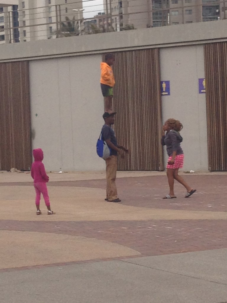 A family entertaining tourist along the Golden Mile Beach in Durban 2015