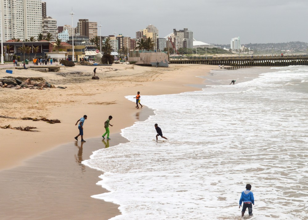 Young Zulu children playing along the Golden Mile beach in Durban 2015